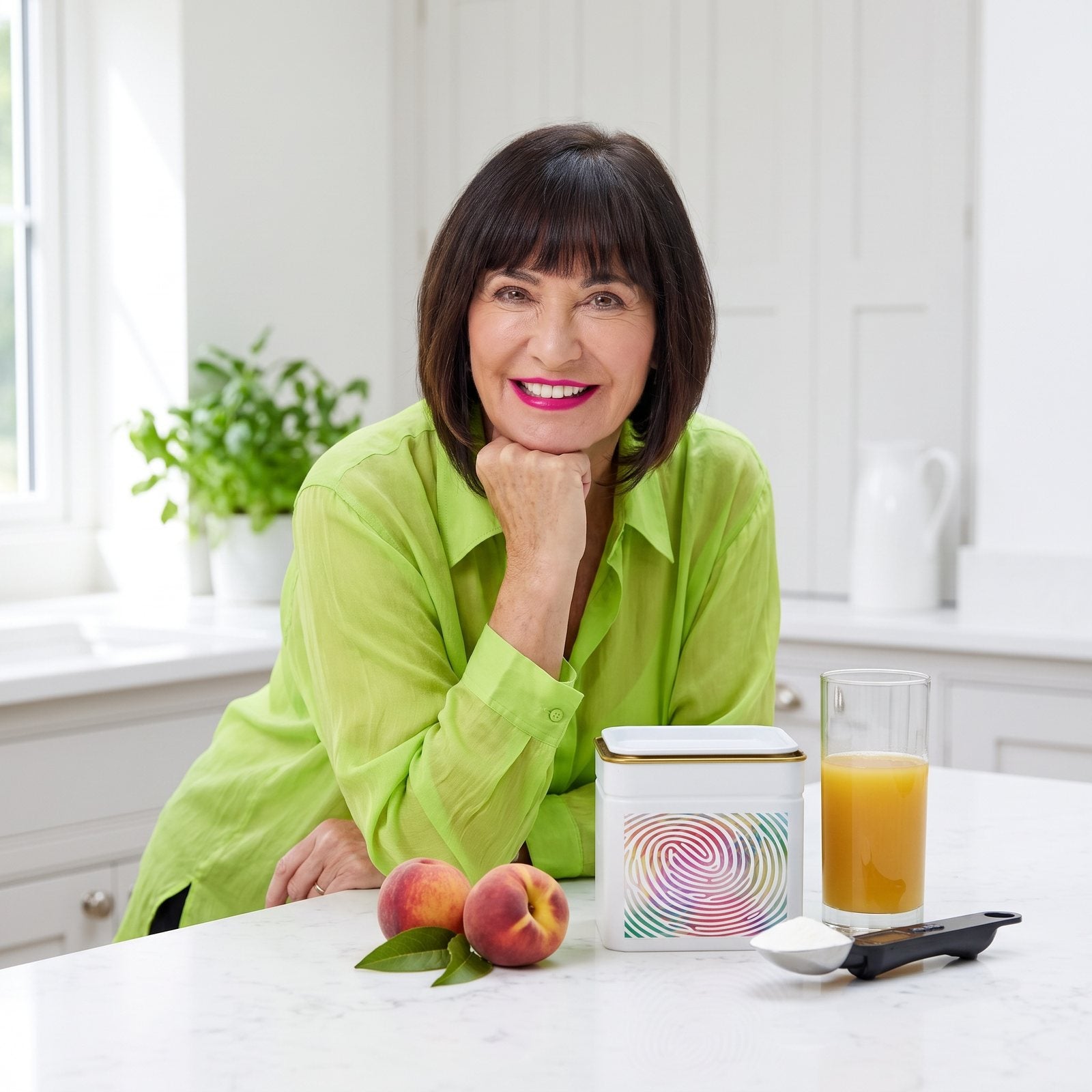Suzie Sawyer leaning on a bright kitchen island with the Daily Calm tin, a glass of juice and the weighing scoop