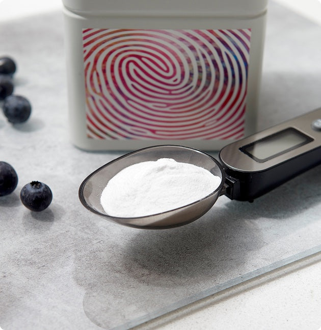 Yutrients tin with scoop and blueberries