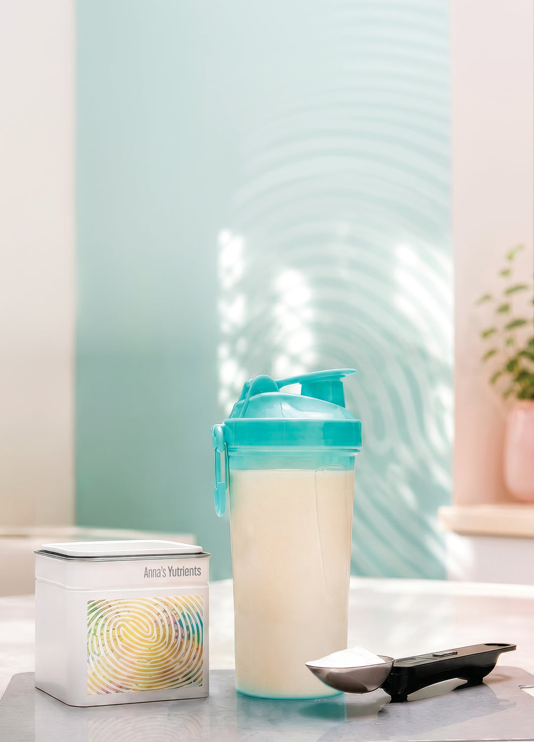 A Yutrients tin beside a mixed shake and weighing spoon