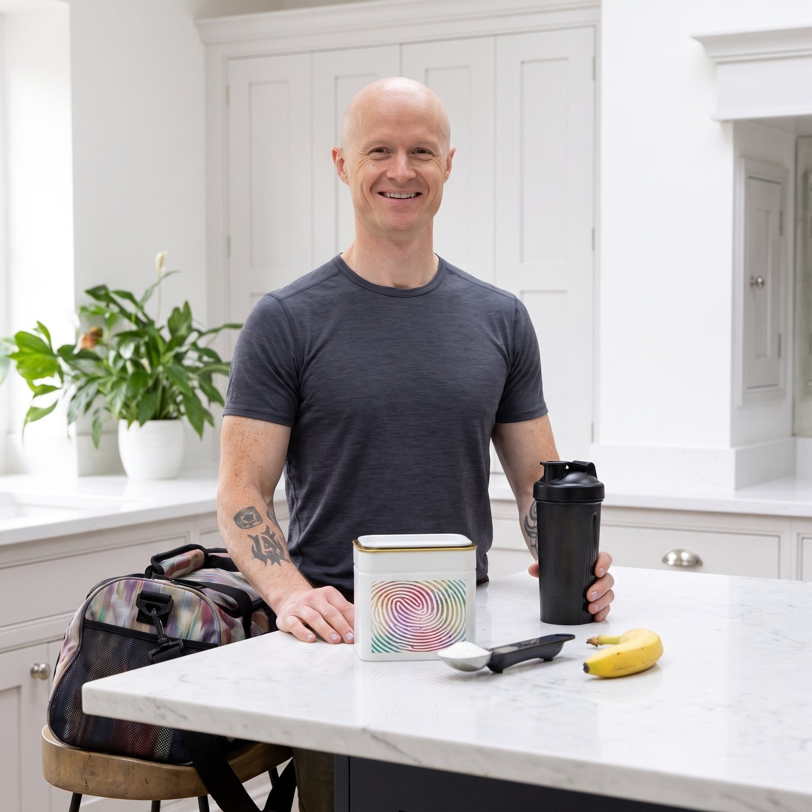 Benjamin Richardson at a kitchen island after training, with a shaker, a Yutrients tin and the digital scoop